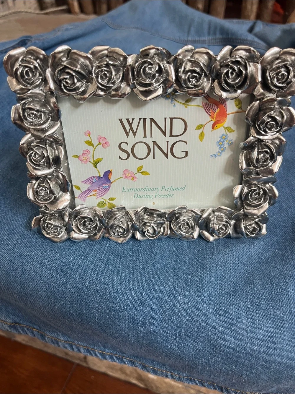 Rose adorned 6 1/2 x 4 1/2 metal frame